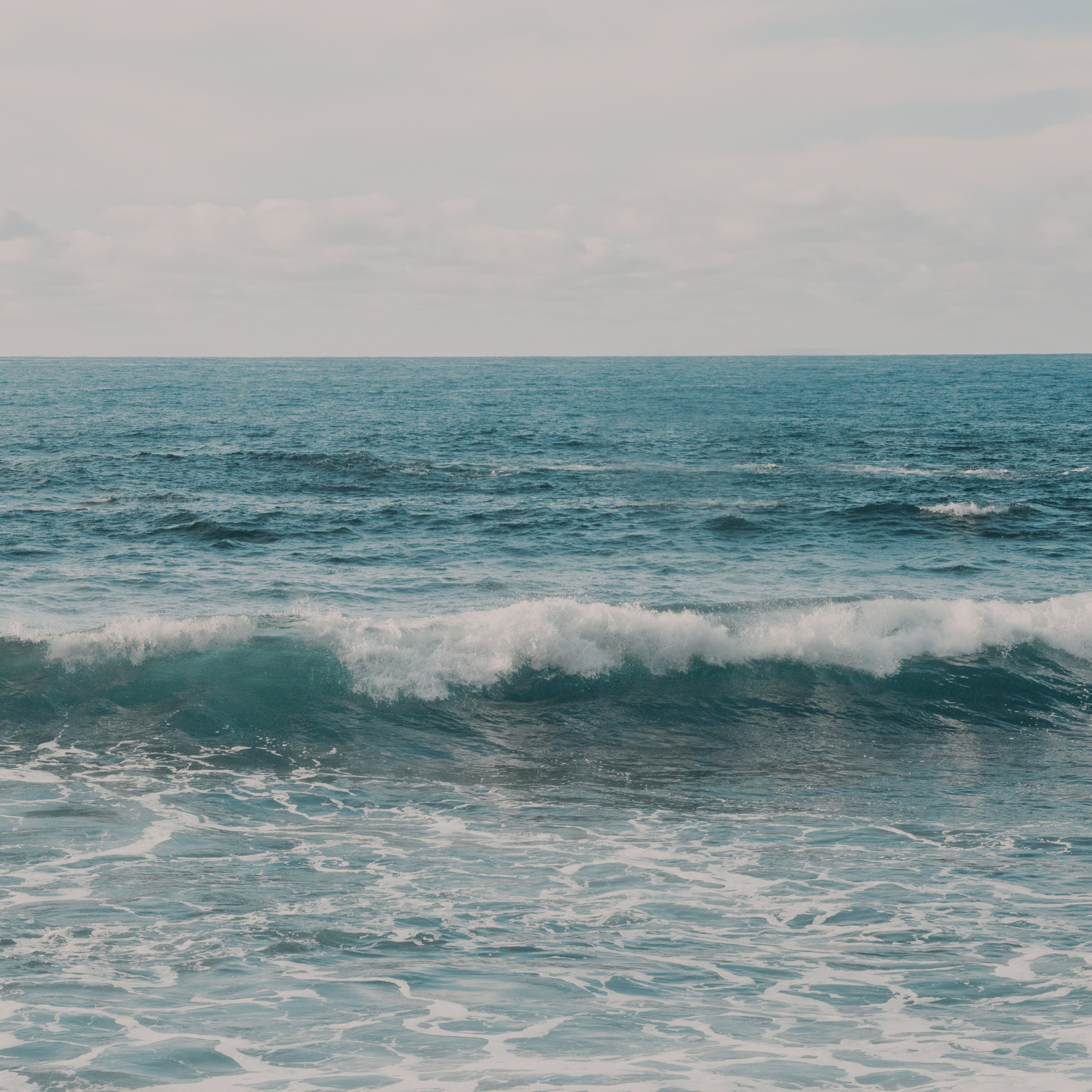 Blue and green ocean waves reflecting coastal color tones for the Coastal Hues candle collection cover image